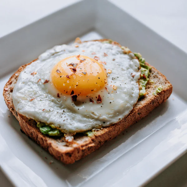 A fried egg on avocado toast
